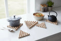 Kitchen trivets made from turned wooden beads