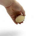 42 mm Birch Wood Egg Shape Ellipsoid Block held in hand for size comparison