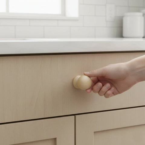 33 mm medium round wooden cabinet knob installed on cabinet door