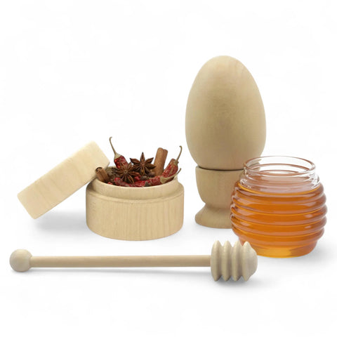 Assorted turned wooden kitchen crafts including tea box, honey dipper and egg holder